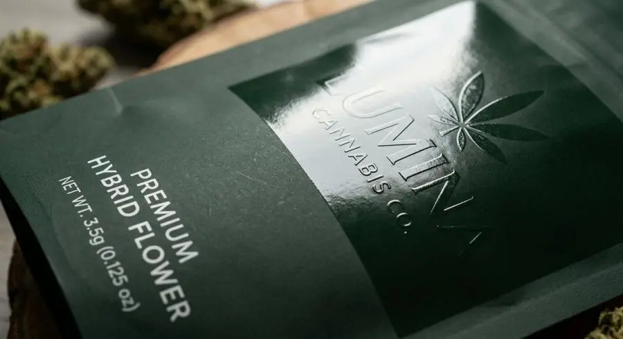 Spot UV gloss coating contrast against matte soft-touch surface on cannabis packaging